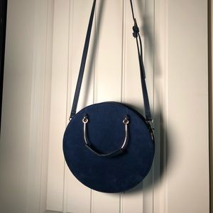 Blue, round crossbody purse